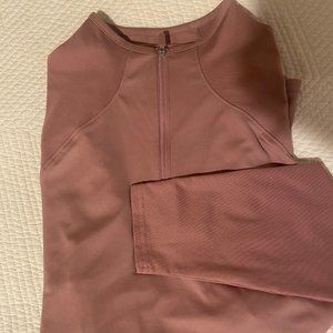 PUMA long sleeve athletic shirt with 1/4 zip front and shirttail hem